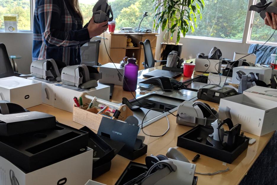 Primacy employees testing multiple Trading Ages VR devices