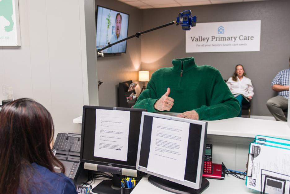 Behind the scenes of filming SCAN Trading Ages VR - actor wearing a head-less body suit with 360 camera mounted where head should be