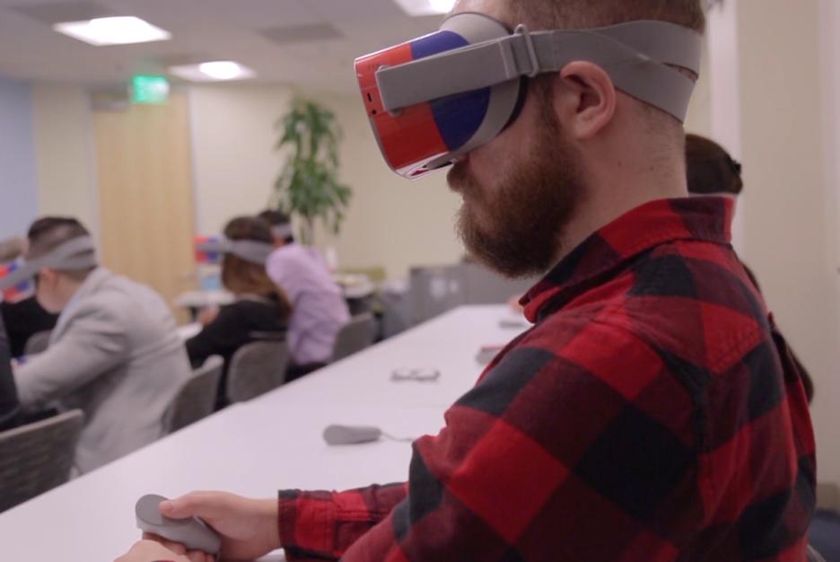 Participant wearing SCAN Trading Ages VR headset