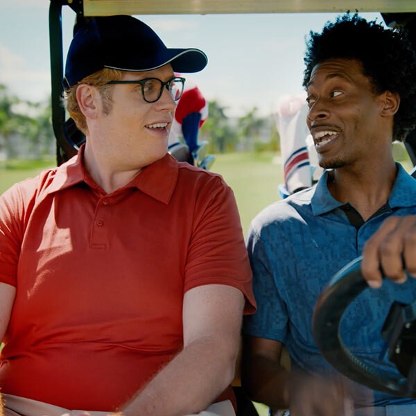 Two golfers in a golf cart
