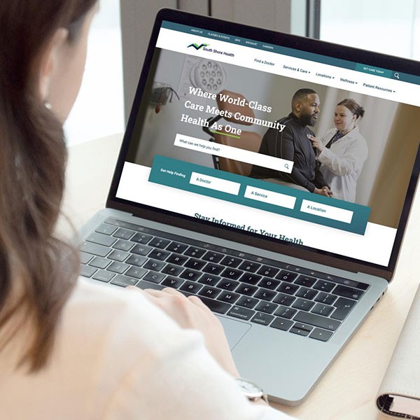 Image of a laptop showing the SouthShore Health website.