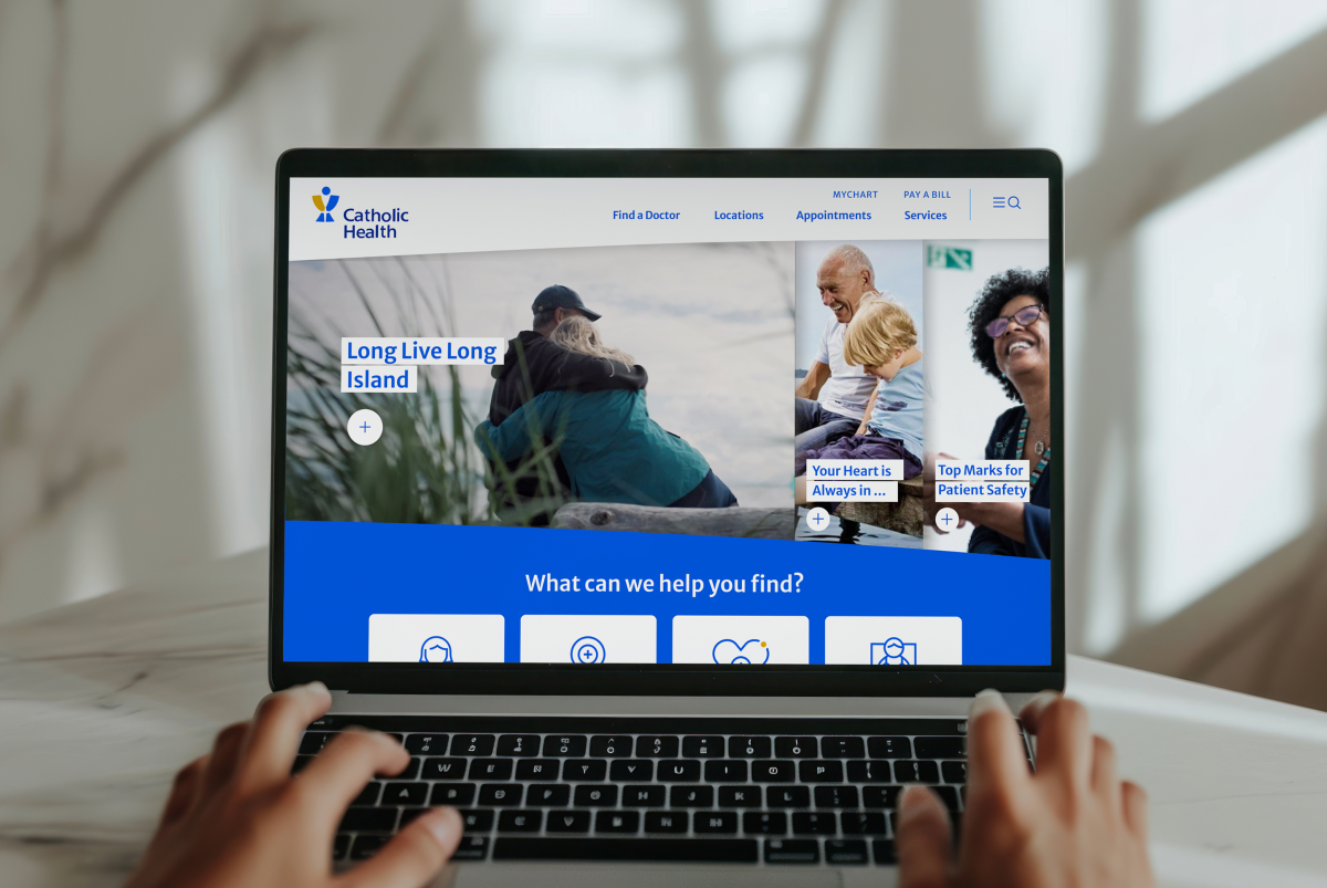 homepage hero in laptop screen of Catholic Health's website